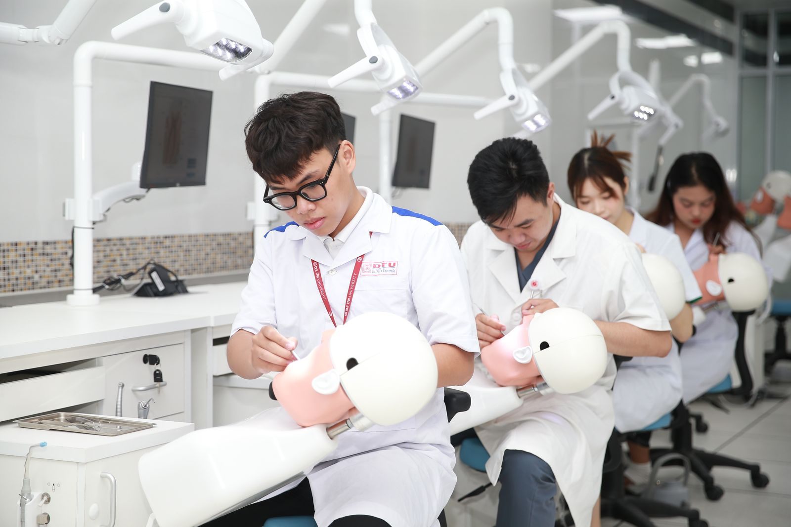 Dental students practicing on training mannequins, the kind of learning behind dental CE cruises